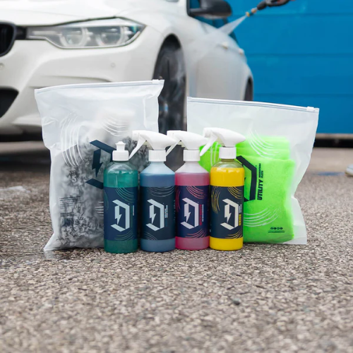 A selection of Duel Autocare car detailing products arranged neatly, showcasing their professional-grade formulas for achieving a glossy, showroom-like finish.