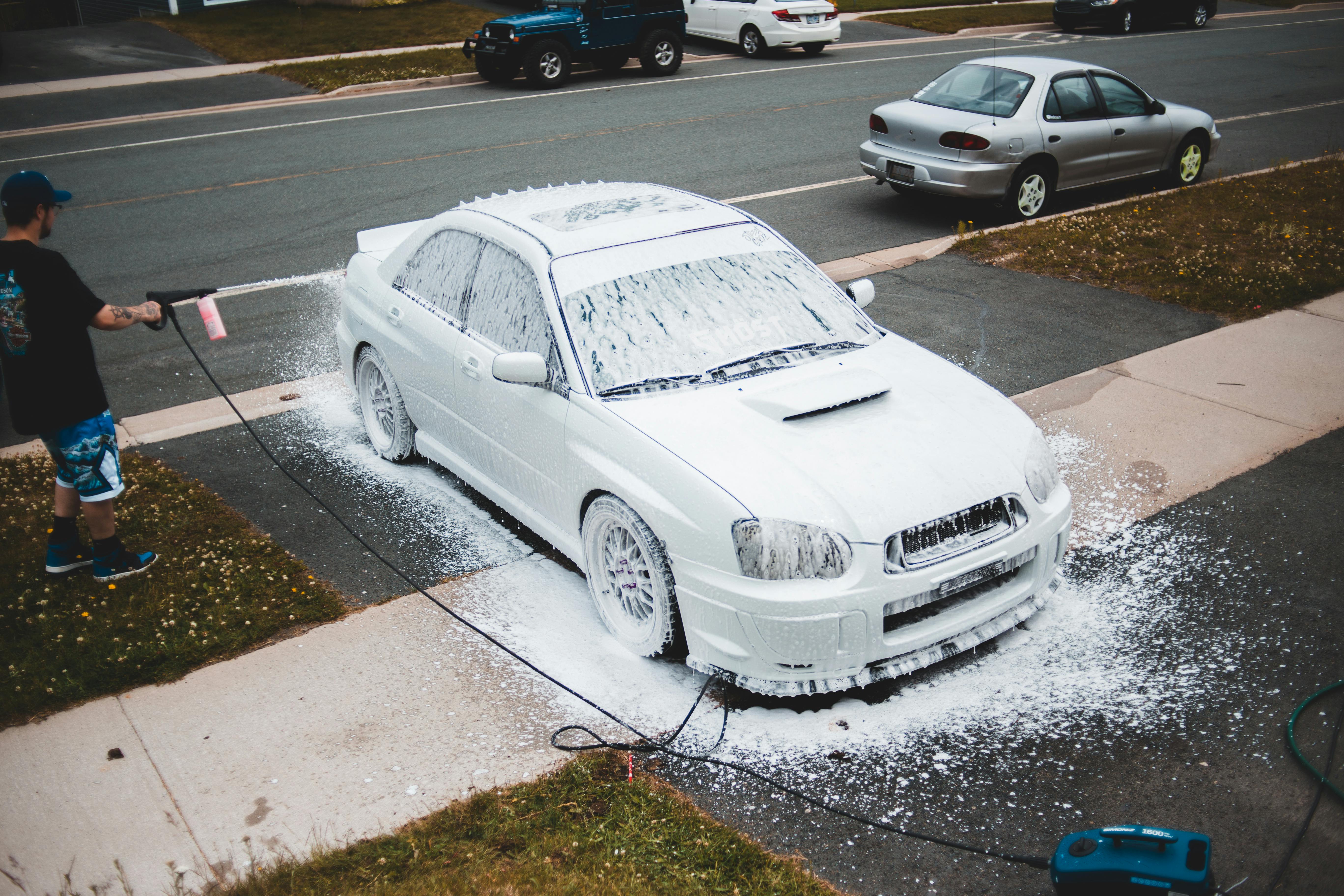 Yum Cars' Top-Tier Detailing Products showcased in a visually appealing car detailing setup, highlighting premium quality and professional results.